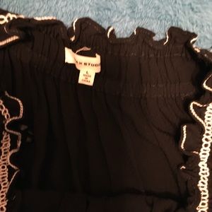 Black free dress with flowers on the hem